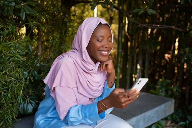 Photo medium shot woman wearing halal outdoors