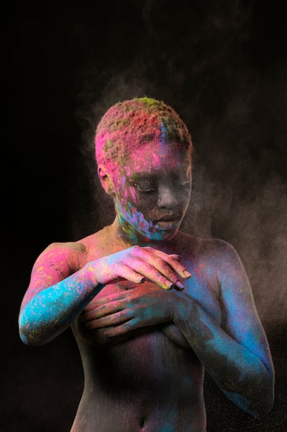 Medium shot woman with colorful powder