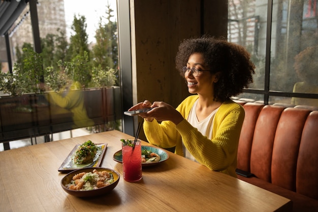 Medium shot woman with delicious food