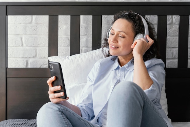 Medium shot woman with headphones