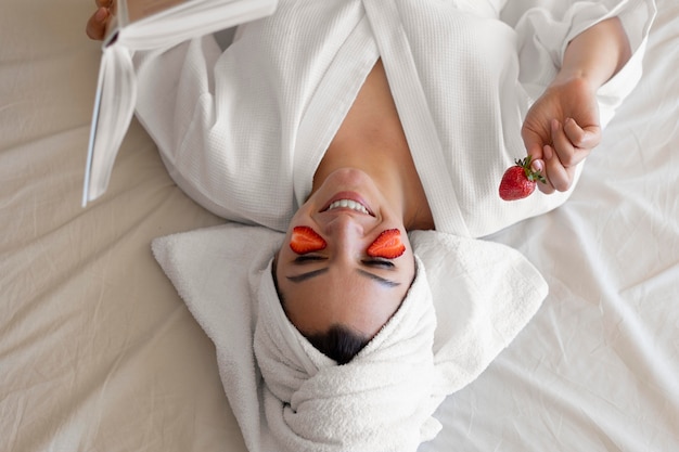 Medium shot woman with strawberries