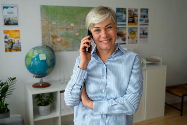 Medium shot woman working as a travel agent