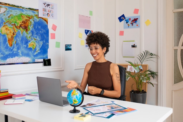 Medium shot woman working in  travel agency