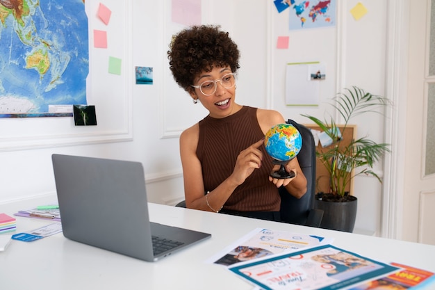 Medium shot woman working in  travel agency