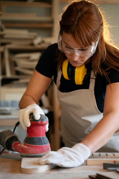 Medium shot woman working with equipment