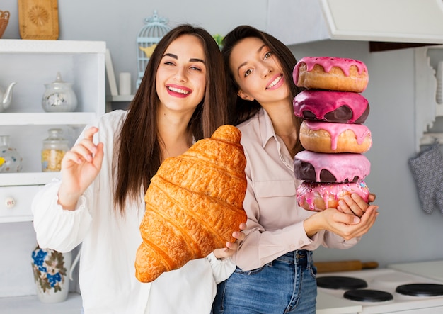 medium shot women with giant dessert