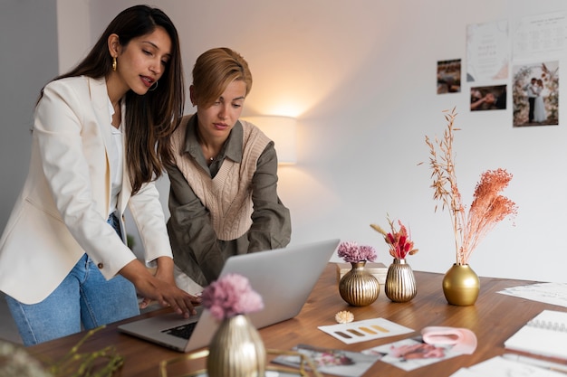 medium shot women working as wedding planners
