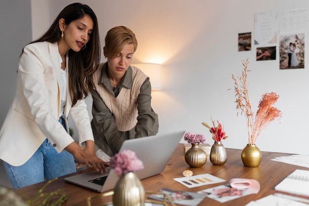 Medium shot women working as wedding planners