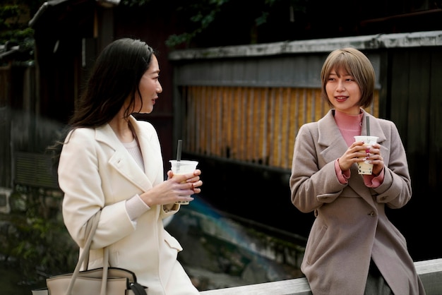 Medium shot young women with bubble tea