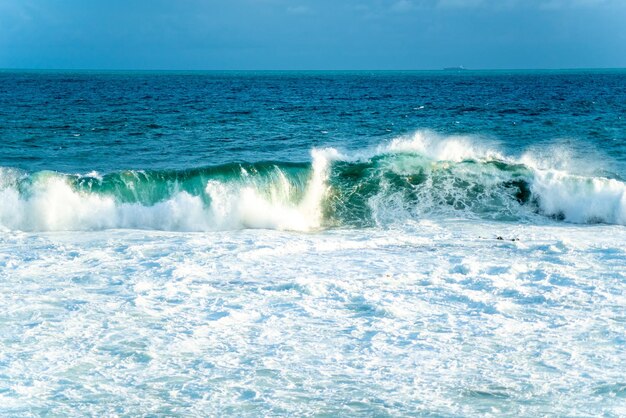 Medium waves crashing on the beach