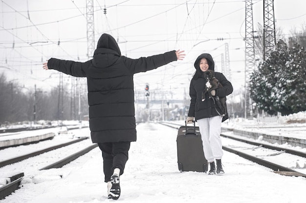 Meeting of two girls at the station Train travel