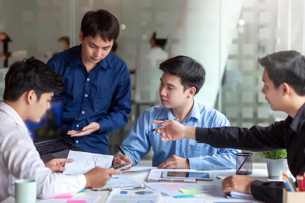 meeting of young asian business people who are committed to work creative business team sitting working together at office