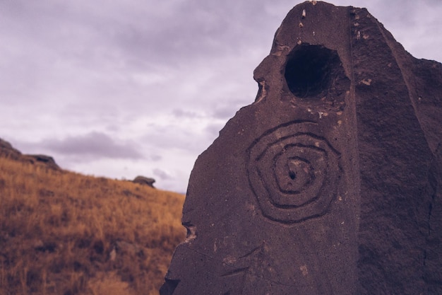 Megalithic standing stones with petroghliphs burial mound of Zorats Karer or Carahunge prehistoric monument in Armenia Armenian Stonehenge stock photography