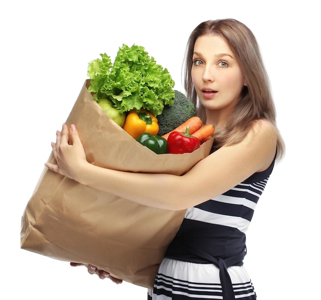 Meisje met groente boodschappen jonge vrouw met een zak boodschappen uit de supermarkt