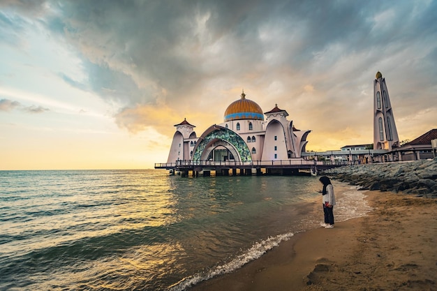 Melaka Straits Mosque Masjid Selat Melaka at sunset light Melaka Malaysia