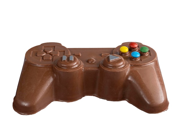 Foto melkschokolade in de vorm van een videogame controller naast kleine konijnen_1