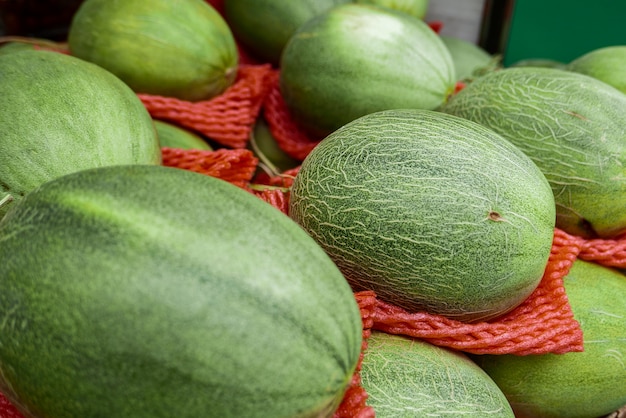 Melon placed for sale on booth at market.