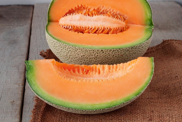 Photo melon sliced on sackcloth.