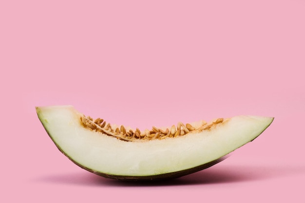 Melon slices on a pink background