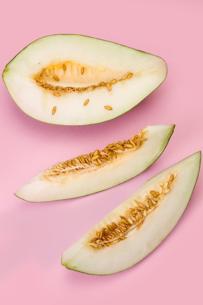 Melon slices on a pink background