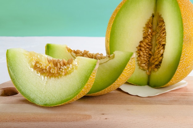 Melon slices on wooden plate. A refreshing tasty sweet melon.