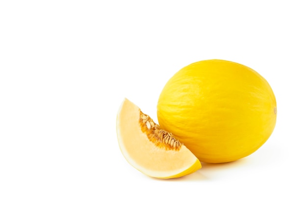 Melon on a white background. Yellow melon on a white isolate. Fresh juicy piece of melon with shadow on a white background. For insertion into a project, design or advertisement.