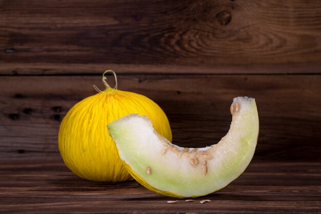 Melon on wooden background