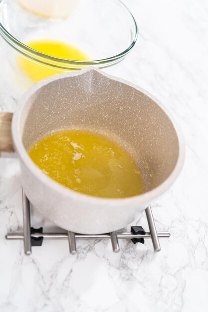 Melted sticks of unsalted butter on the counter