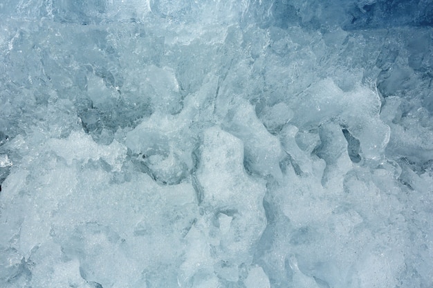 Melting glacial block of ice closeup.