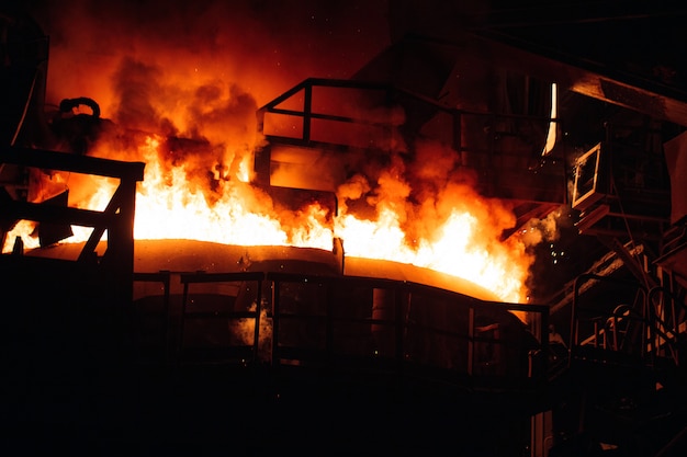 Melting of metal in a steel plant. High temperature in the melting furnace.