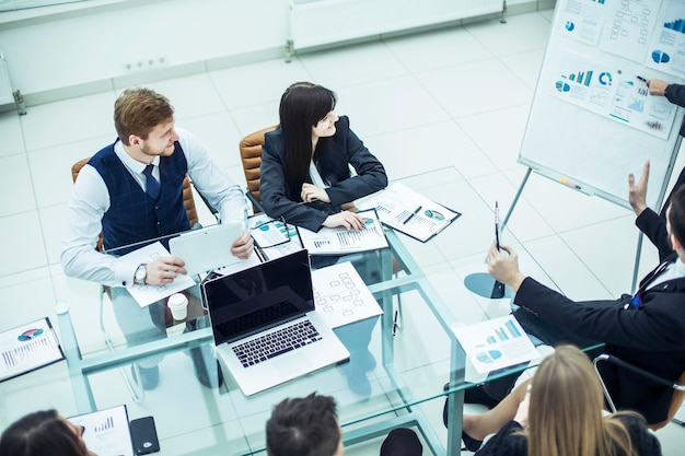 Members of a business team discussing the presentation of a new financial project