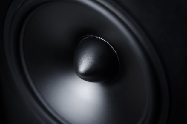 Membrane sound speaker on black, close up