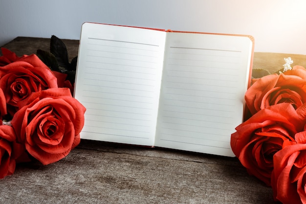 Memo, notebook with bouquet of red roses