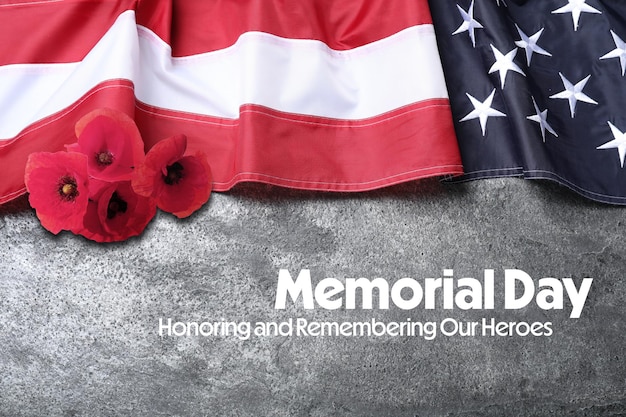 Memorial Day Honoring and Remembering American flag and red poppy flowers on grey background