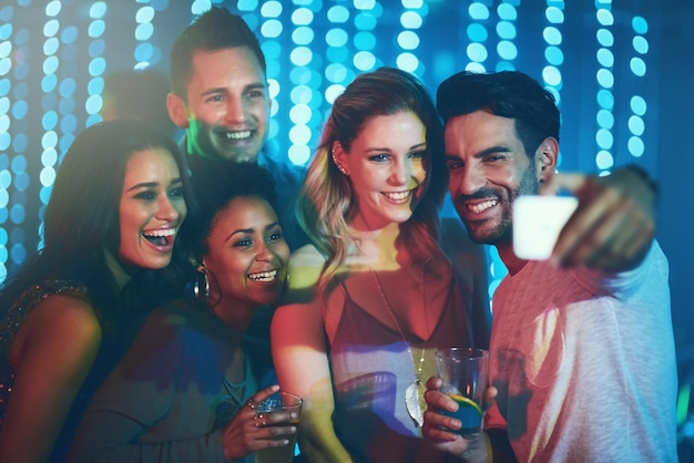 Memories worth capturing Shot of a group of friends posing for a selfie together in a nightclub