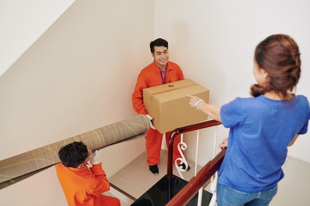 Men Carrying Things Upstairs