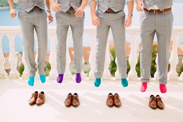 Men in colorful socks funny jump