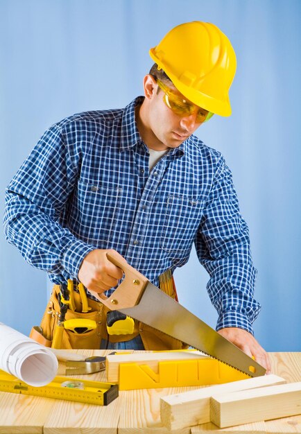 Men cutting plank