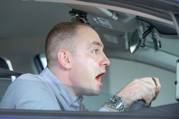 Men driving. emotion. Screaming, scared. Human emotion face expression.