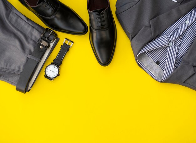 Premium Photo | Men fashion clothing set isolated on a yellow background.  business clothes concept