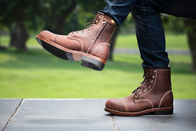 Photo men fashion concept. brown boots leather with zipper.