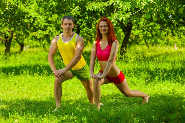 Men and female stretching muscles