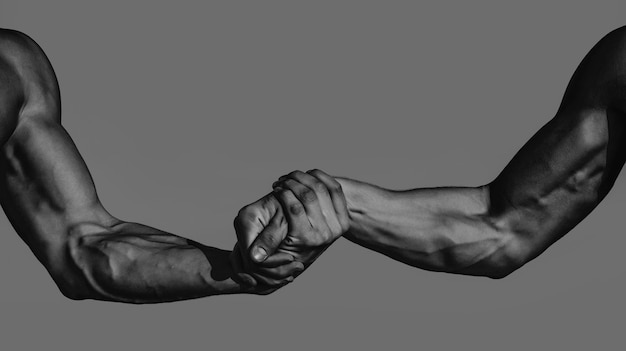 Photo men hand support close up help hand isolated two hands of muscular men rescue helping gesture or hands strong hold muscular men arms