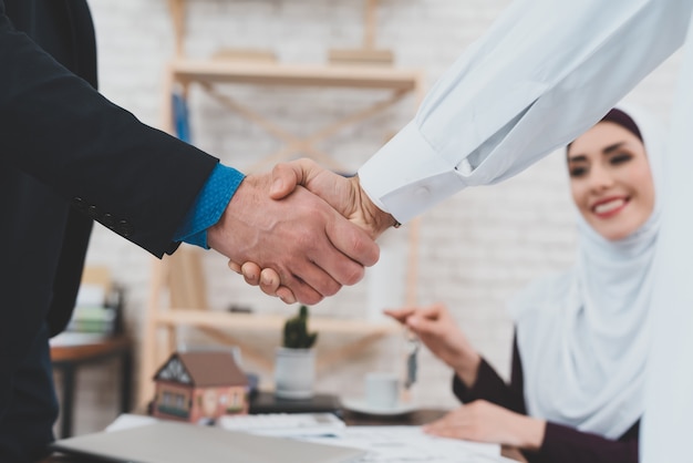 Men Handshaking Arab People Business Partnership.