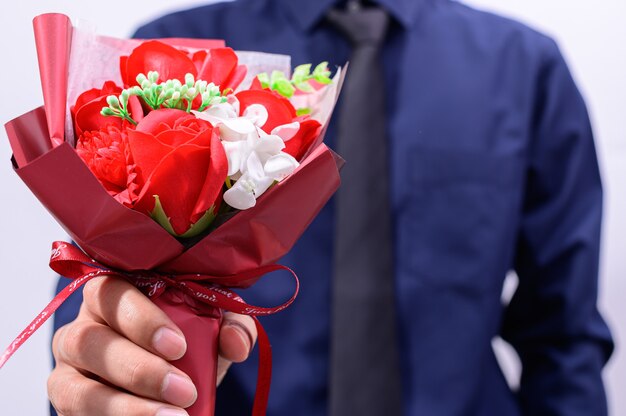 Men hold a bouquet of roses on valentine's day