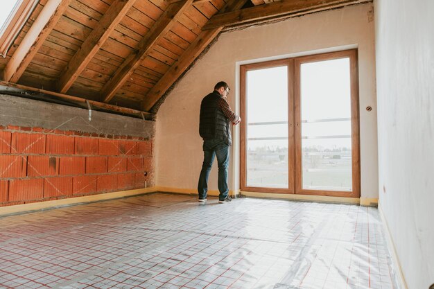 Men inside new house construction site