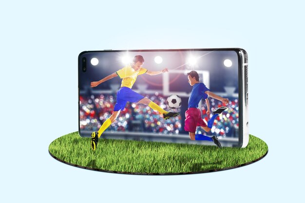 Photo men kicking soccer ball on mobile phone screen