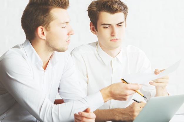 Men in office working on project