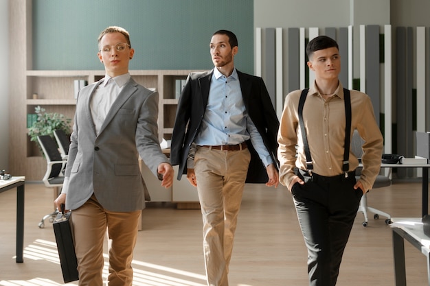 Men performing vogue dance indoors