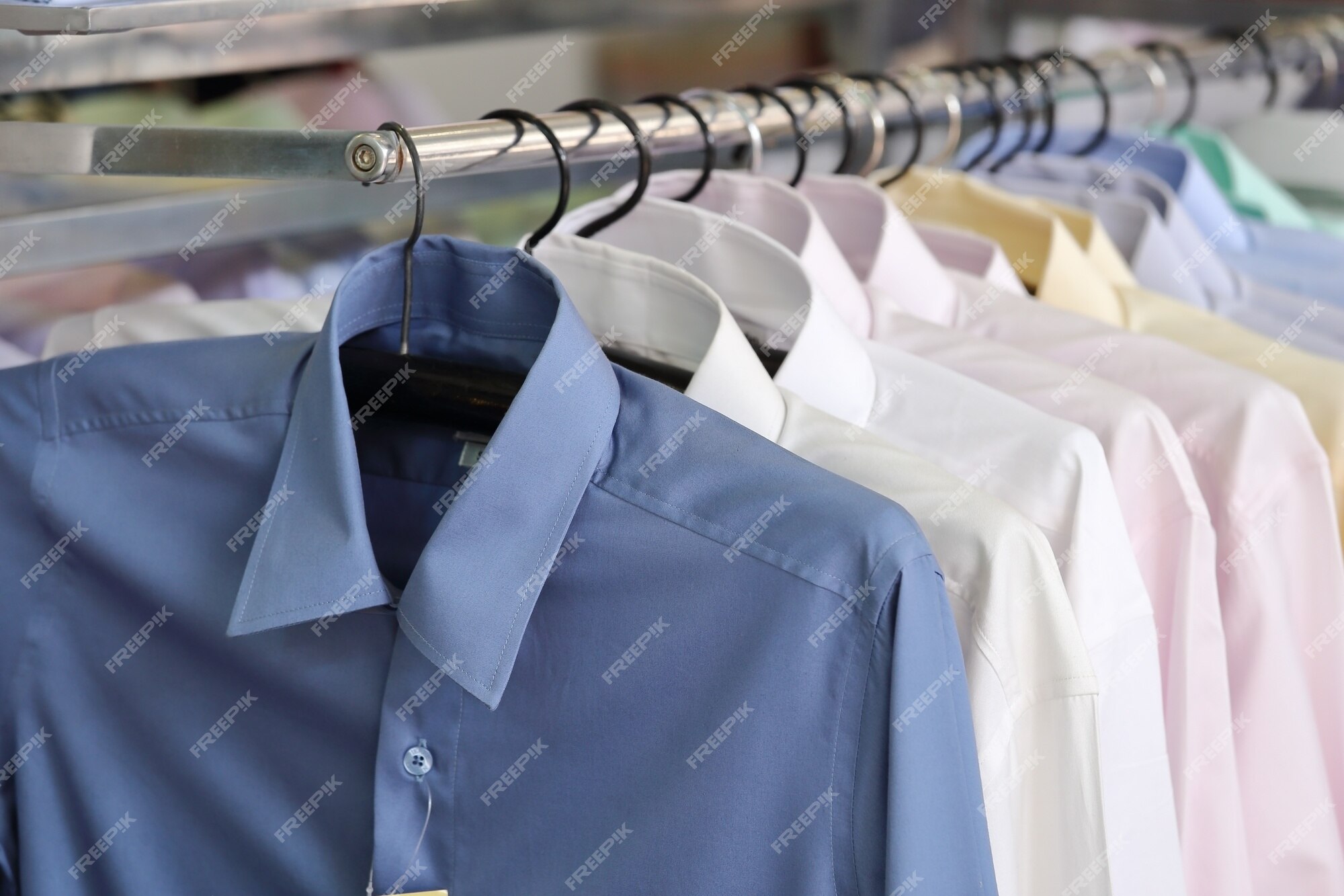 Premium Photo  Men plain shirts on hangers in a retail store